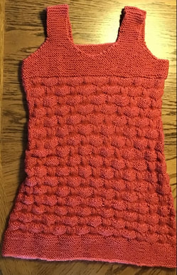 Textured knit dress in coral yarn